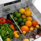ZLINE Autograph Edition 24 in. Touchstone 168 Can Outdoor-Rated Dual Refrigerator Drawer with Stainless Steel Doors and Champagne Bronze Helix Handles (RDSOZ-ST-24-KCB) refrigeration compartment open with fruits, vegetables, and drinks inside.