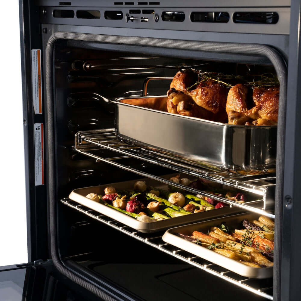 ZLINE Autograph Edition 30 in. Professional True Convection Double Wall Oven with Air Fry and Self Clean in Stainless Steel with Champagne Bronze Helix Handles (WADZ-30-KCB) roasted chicken and vegetables in oven with a metal roasting pan.