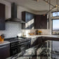 ZLINE Wall Mount Range Hood in Black Stainless Steel (BSKBN) and ZLINE Range in a luxury kitchen.