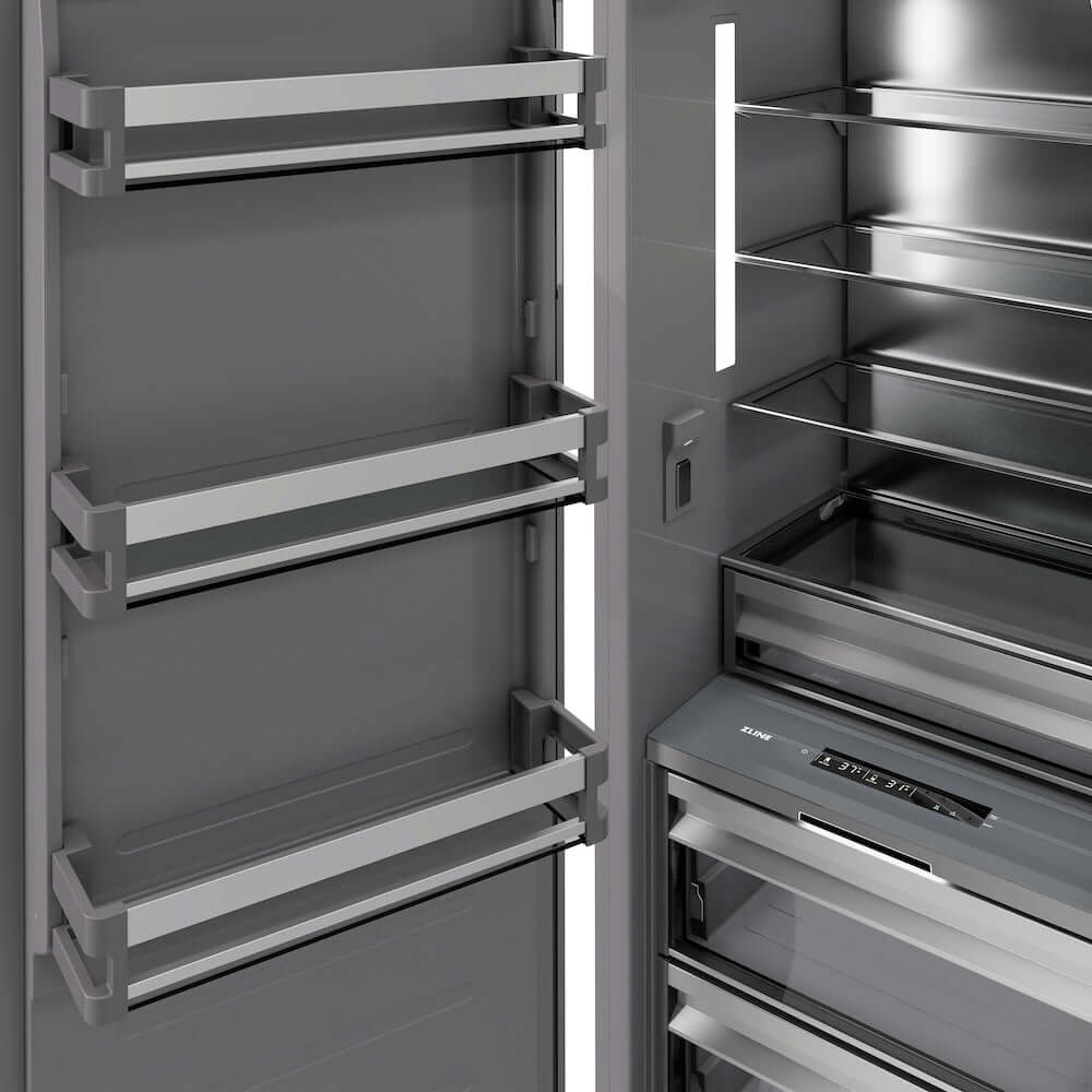 ZLINE Autograph Edition 24 in. 12.5 cu. ft. Panel Ready Column Refrigerator with Graphite Gray Interior and Champagne Bronze Accents (RBCRVZ-24-CB) door open detail.
