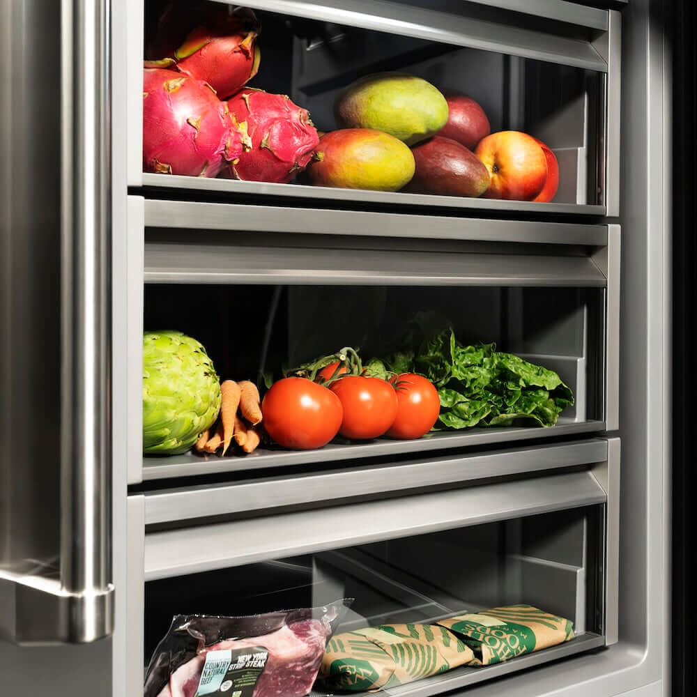ZLINE Autograph Edition 24 in. 12.5 cu. ft. Panel Ready Column Refrigerator with Graphite Gray Interior and Champagne Bronze Accents (RBCRVZ-24-CB) food inside drawers.