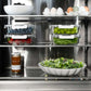 ZLINE Autograph Edition 24 in. 12.5 cu. ft. Panel Ready Column Refrigerator with Graphite Gray Interior and Polished Gold Accents (RBCRVZ-24-G) shelving with food.