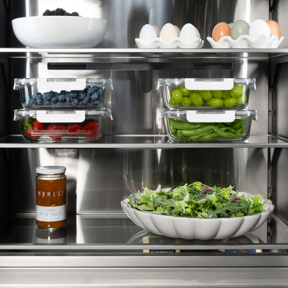 ZLINE Autograph Edition 24 in. 12.5 cu. ft. Panel Ready Column Refrigerator with Graphite Gray Interior and Matte Black Accents (RBCRVZ-24-MB) shelving with food.