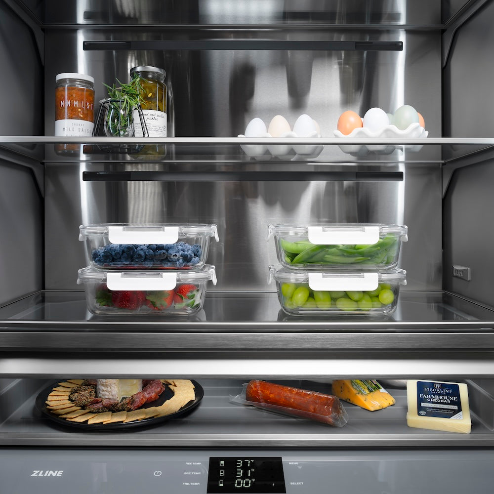 ZLINE 30 in. 16.1 cu. ft. Panel Ready Built-In Bottom Freezer Refrigerator with Water Dispenser and Ice Maker with Graphite Gray Interior (GRBIV-30) close-up, food inside refrigeration compartment.