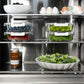 ZLINE Autograph Edition 24 in. 12.5 cu. ft. Column Refrigerator in Satin Stainless Steel with Graphite Gray Interior and Polished Gold Accents (RCRVZ-SN-24-G) shelving with food.