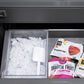 ZLINE Autograph Edition 36 in. 19.6 cu. ft. French Door Built-In Bottom Freezer Refrigerator with Water Dispenser and Ice Maker in Stainless Steel with Graphite Gray Interior and Champagne Bronze Accents (GRBIVZ-304-36CB) close-up, ice and ice scoop in bottom freezer.