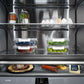 ZLINE Autograph Edition 60 in. 32.2 cu. ft. French Door Built-In Bottom Freezer Refrigerator with Water Dispenser and Ice Maker in Stainless Steel with Graphite Gray Interior and Polished Gold Helix Handles (GRBIVZ-30460KG) spacious interior with food items in clear containers.