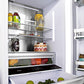ZLINE 30 in. 16.1 cu. ft. Built-In Bottom Freezer Refrigerator with Water Dispenser and Ice Maker in Stainless Steel (RBIV-304-30) close-up detail, food above drawer inside refrigeration compartment.