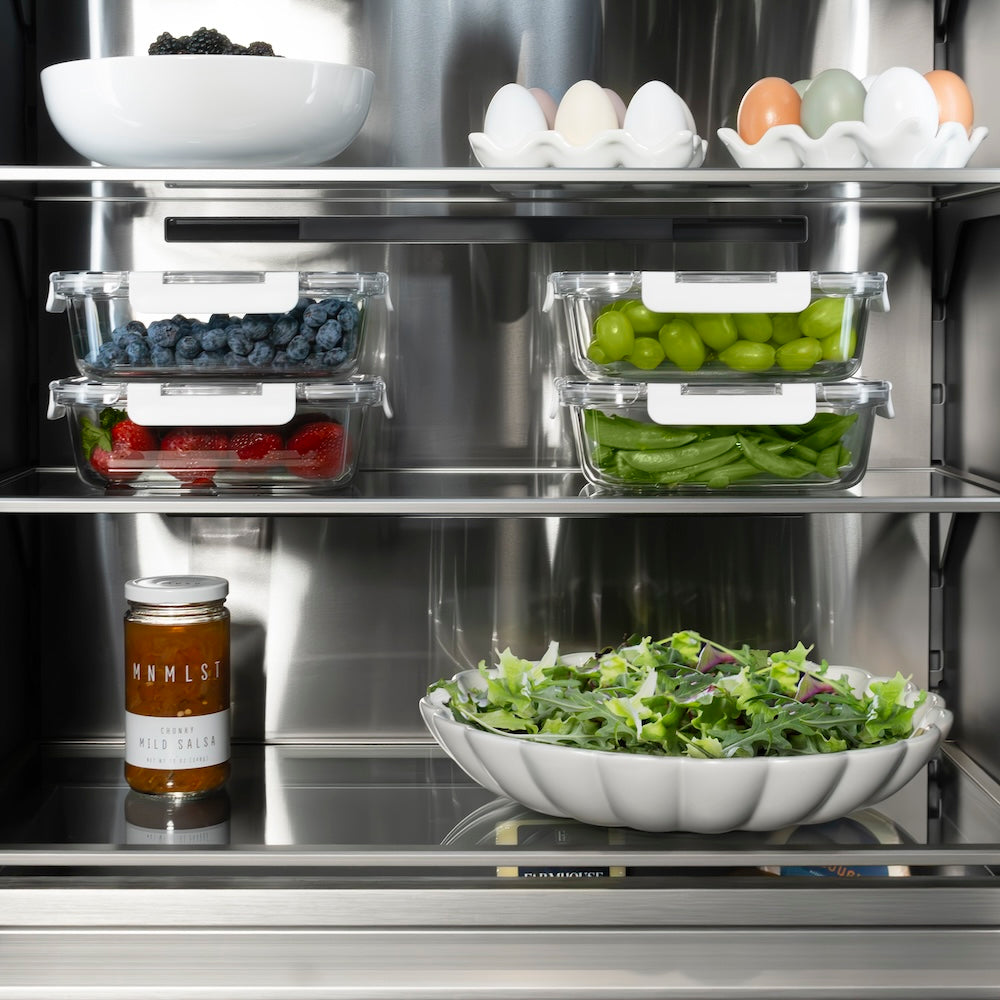 ZLINE Autograph Edition 30 in. 16.7 cu. ft. Column Refrigerator in White Matte with Graphite Gray Interior and Champagne Bronze Accents (RCRVZ-WM-30-CB) shelving with food.