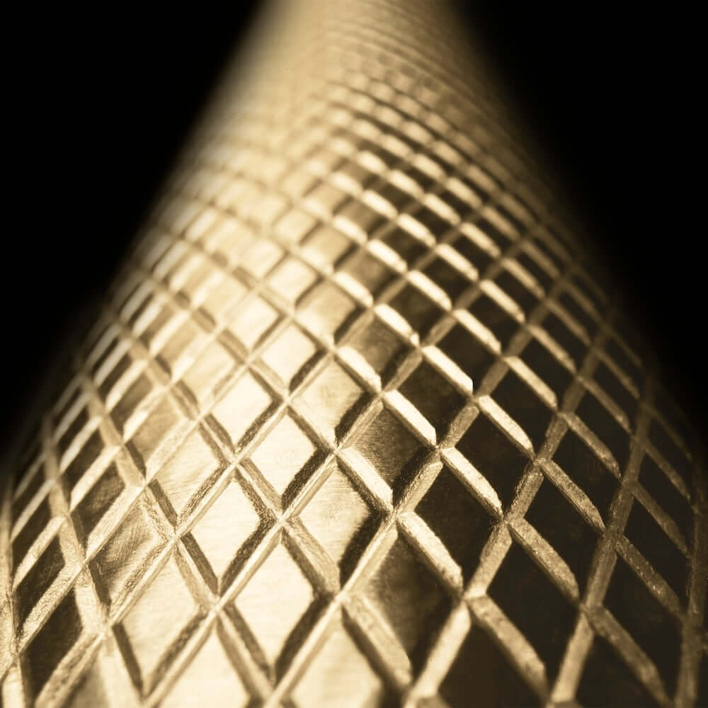 ZLINE Autograph Edition 36 in. 22.5 cu. ft. Counter-Depth French Door Refrigerator with Ice Maker in Fingerprint-Resistant Stainless Steel and Champagne Bronze Helix Handles (RFMZ-36-KCB) close-up of Helix handle with knurled diamond texture.