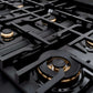 ZLINE Autograph Edition 36 in. 5.2 cu. ft. Classic Dual Fuel Range with 6 Burner Gas Cooktop and Electric Convection Oven in Black Stainless Steel with Champagne Bronze Accents (CDRBZ-36-CB) close-up, Dual Function brass burner.