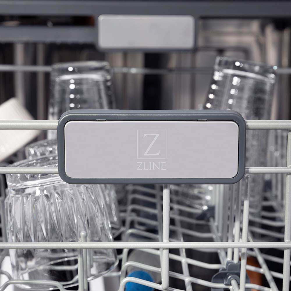 ZLINE Autograph Edition 24 in. Monument Series 3rd Rack Top Touch Control Tall Tub Dishwasher in White Matte with Polished Gold Handle, 45dBa (DWMTZ-WM-24-G) ZLINE logo on dish rack.