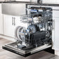 ZLINE Autograph Edition 18 in. Tallac Series 3rd Rack Top Control Built-In Dishwasher in Black Stainless Steel with Champagne Bronze Handle, 51dBa (DWVZ-BS-18-CB) open with dishes loaded inside in a luxury kitchen, side.