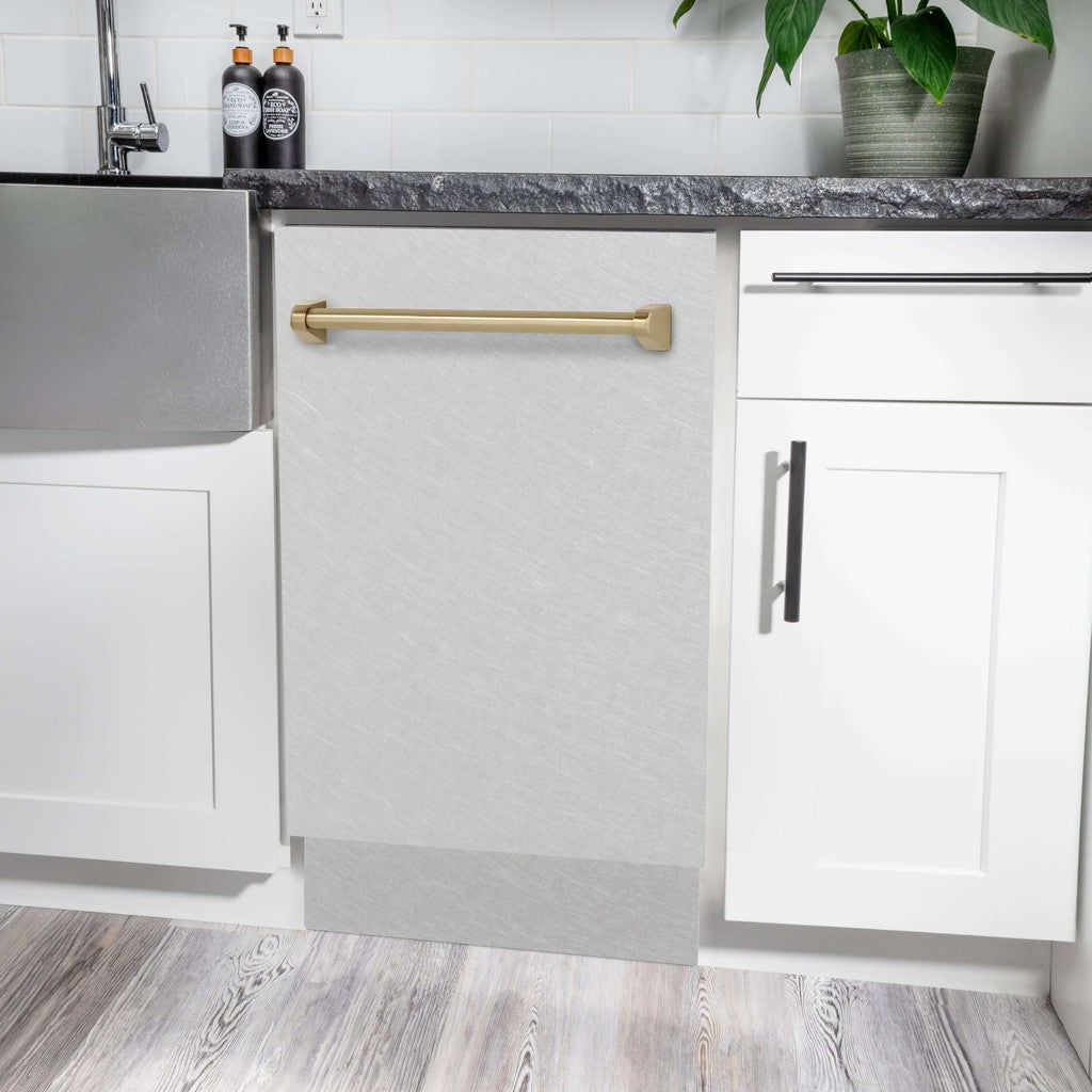 ZLINE Autograph Edition 18 in. Tallac Series 3rd Rack Top Control Built-In Dishwasher in Fingerprint Resistant Stainless Steel with Champagne Bronze Handle, 51dBa (DWVZ-SN-18-CB) built-in to white cabinets with granite countertops in a luxury kitchen.