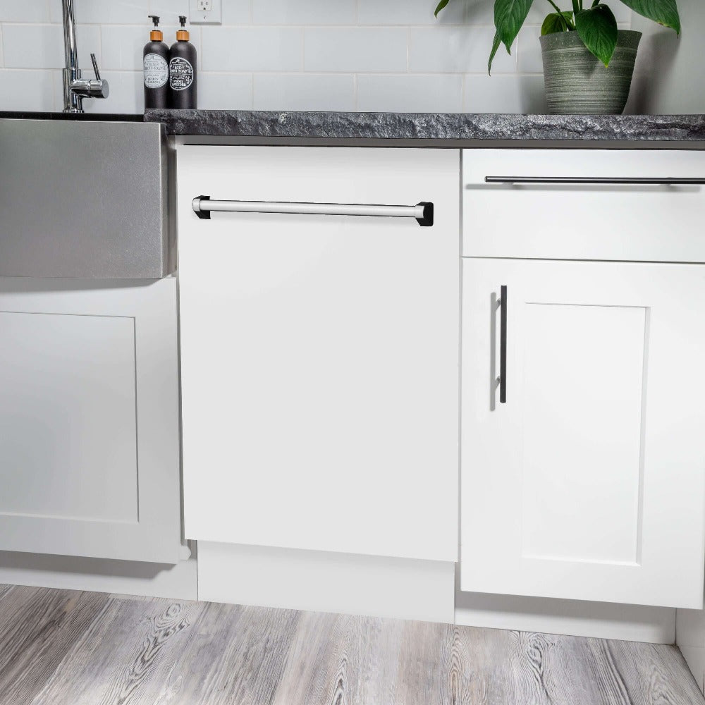 ZLINE 18 in. Tallac Series 3rd Rack Top Control Built-In Dishwasher in White Matte with Stainless Steel Tub, 51dBa (DWV-WM-18) built-in to white cabinets with granite countertops in a luxury kitchen.