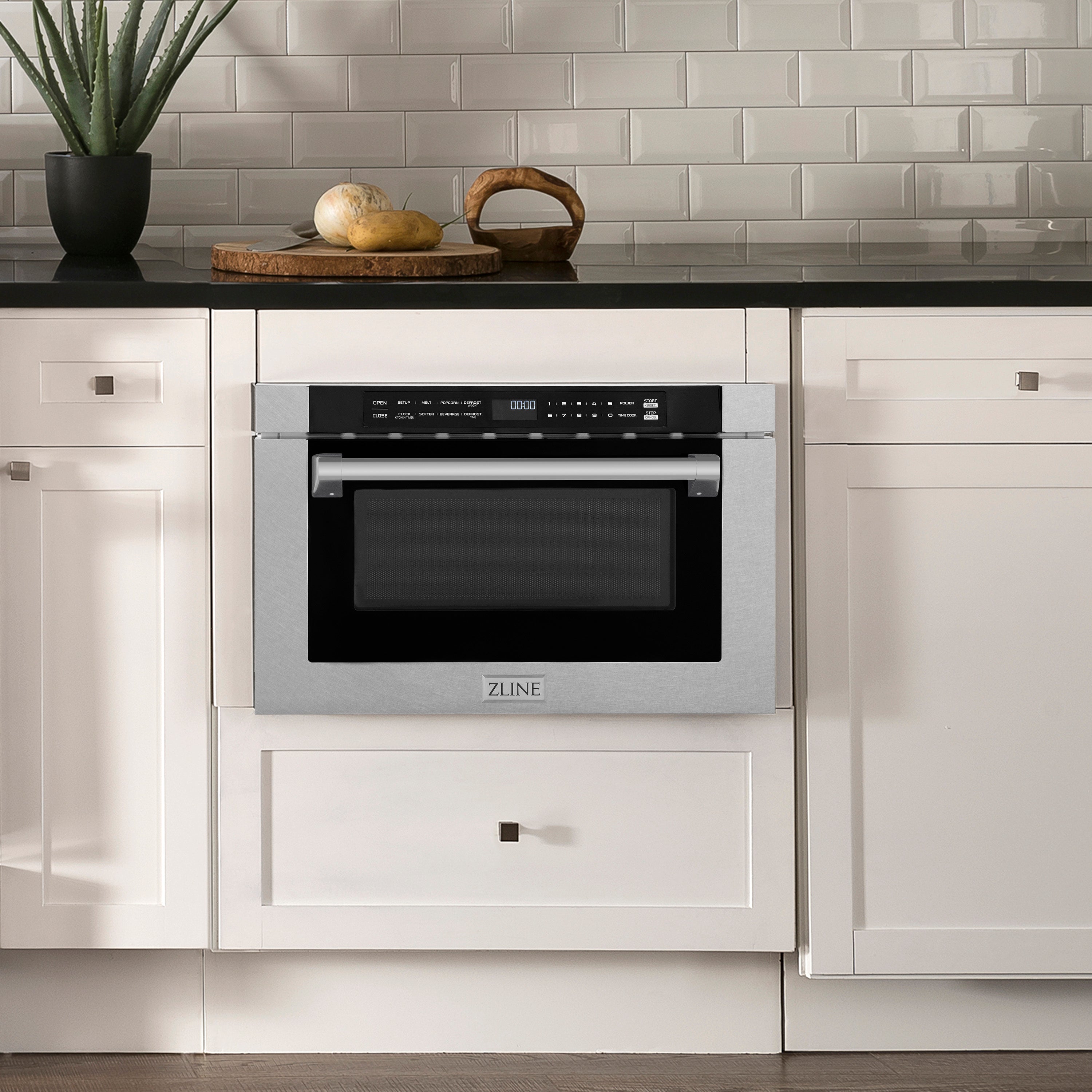 ZLINE 24 in. 1.2 cu. ft. Built-in Microwave Drawer with a Traditional Handle in DuraSnow Stainless Steel (MWD-1-SS-H) in Rustic Farmhouse Kitchen with white cabinets and black countertops.