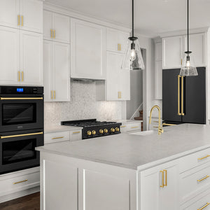 ZLINE Autograph Edition 36 in. 21.6 cu. ft. Counter-Depth French Door Refrigerator with Water and Ice Dispenser in Fingerprint-Resistant Black Stainless Steel with Polished Gold Traditional Handles (RFMZ-W-36-BS-G) in a kitchen with white cabinets, black appliances, and gold fixtures.