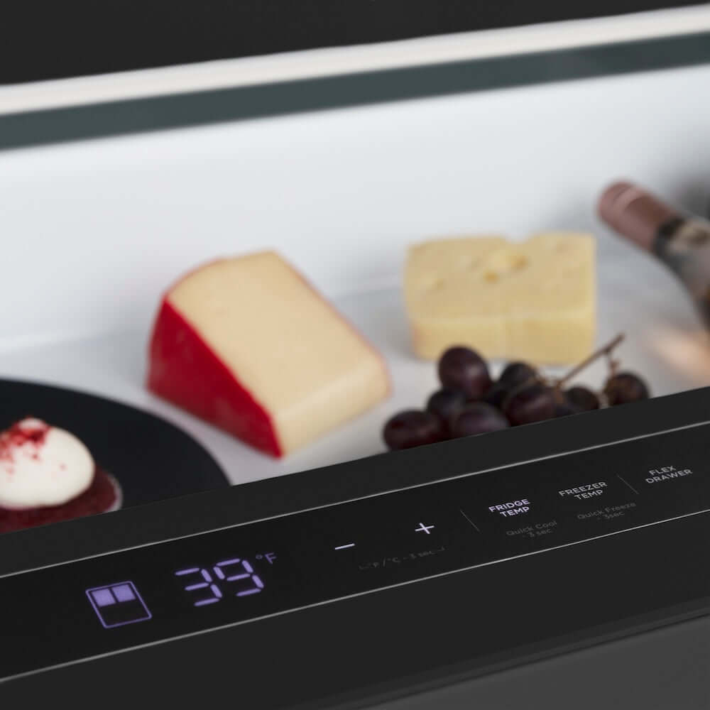 ZLINE Autograph Edition 36 in. 21.6 cu. ft. Counter-Depth French Door Refrigerator with Water and Ice Dispenser in Fingerprint-Resistant Black Stainless Steel with Polished Gold Helix Handles (RFMZ-W-36-BS-KG) close-up of a digital temperature display and controls with food items in the background.