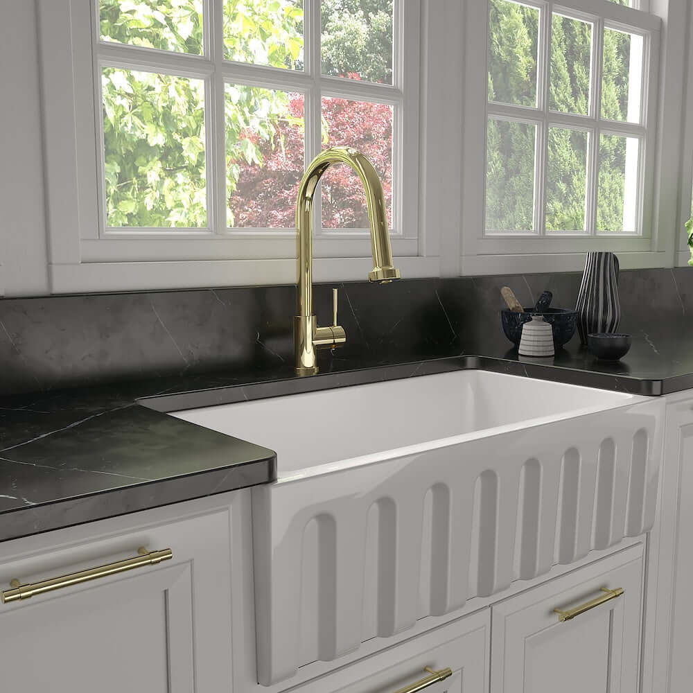 Kitchen sink with ZLINE Monet Kitchen Faucet in Polished Gold (MON-KF-PG) and fixtures in a modern kitchen setting.