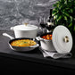 ZLINE 5-Piece Enameled Cast Iron Cookware Set in White Matte (CWSETS-WM-5) on a dark counter with wine glasses.