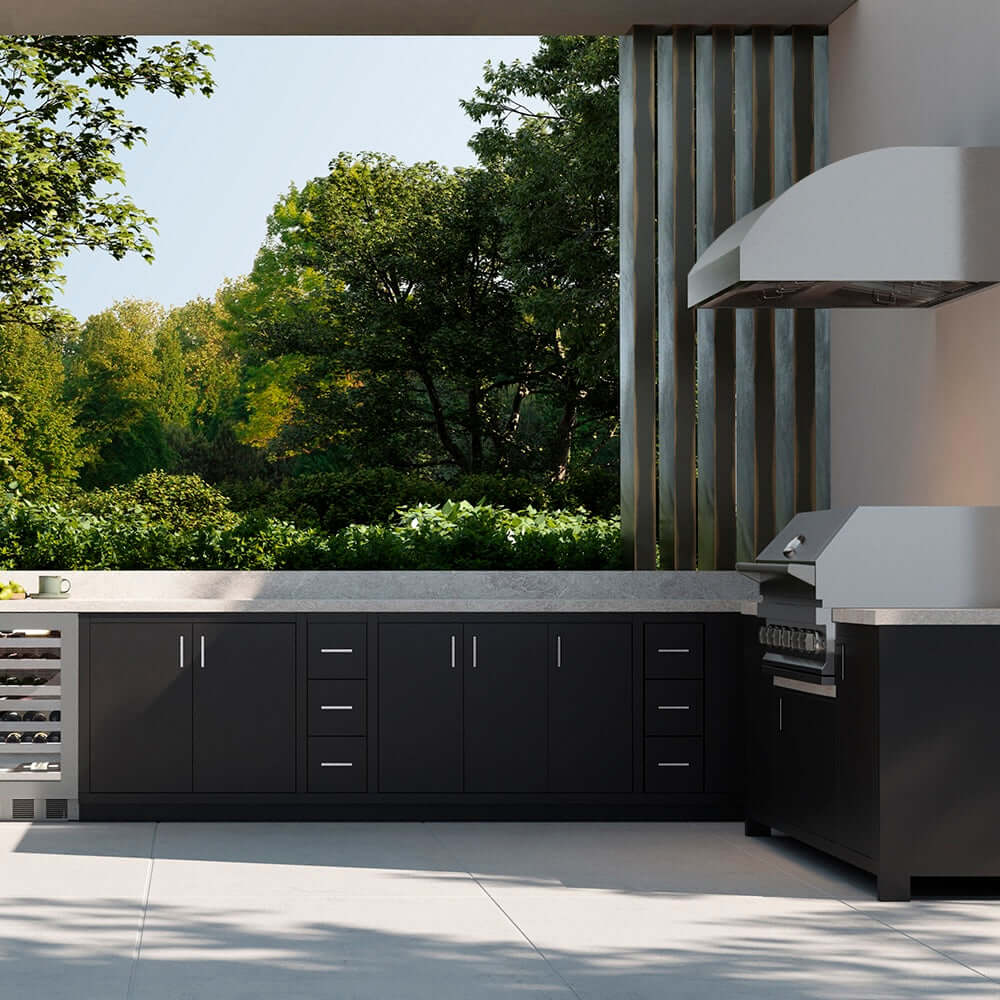 Outdoor kitchen with grill and grill hood.