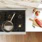 ZLINE 48 in. 6.7 cu. ft. Paramount Dual Fuel Range with 8 Burner DuoPro™ Cooktop and Dual Ovens in Stainless Steel (PSDR48) top-down, above cooktop.