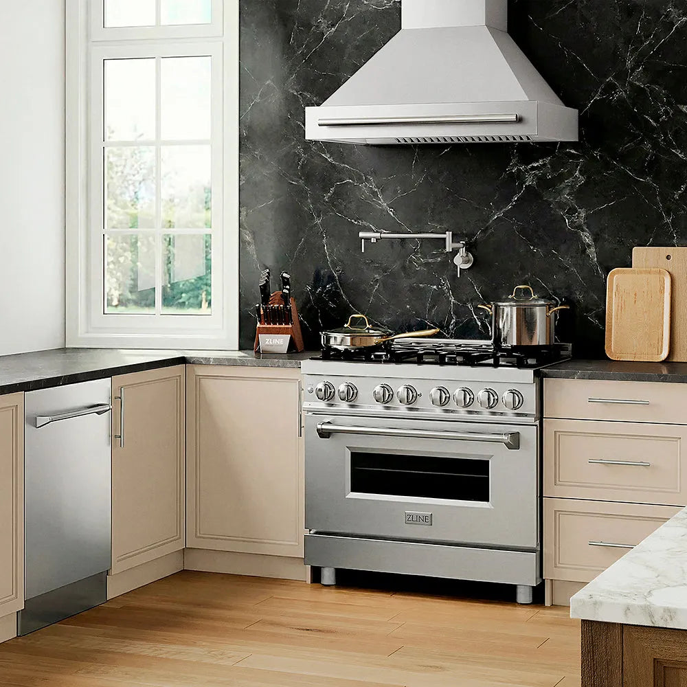 Designer kitchen with ZLINE 36 in. 4.6 cu. ft. Legacy Dual Fuel Range with 6 Burner Gas Cooktop and Electric Convection Oven in Stainless Steel (RA36), range hood, marble backsplash, and wooden flooring.