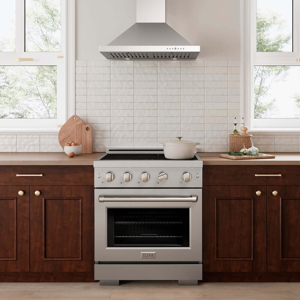 ZLINE 30 in. 4.2 cu. ft. Paramount Induction Range with 4 Element Cooktop and Electric Convection Oven in Stainless Steel (SINR30) in a kitchen with wooden cabinets and white tiled walls.