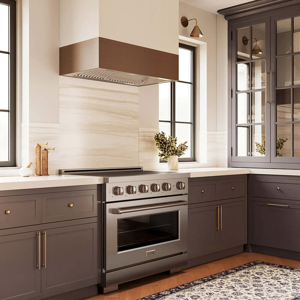 ZLINE 36 in. 5.2 cu. ft. Paramount Induction Range with 5 Element Cooktop and Electric Convection Oven in Stainless Steel (SINR36) in a modern kitchen with a custom range hood and gray cabinets