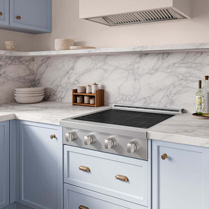 ZLINE 30 in. Paramount Induction Rangetop with 4 Element Cooktop in Stainless Steel (SINRT30) set into light blue kitchen cabinets with a white marble backsplash and matching marble countertop.