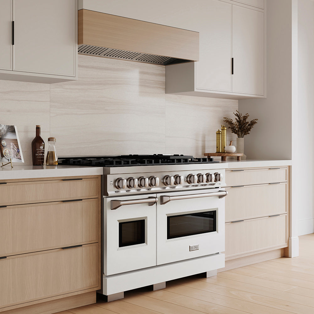 ZLINE 48 in. 6.7 cu. ft. Classic Dual Fuel Range with 8 Burner DuoPro™ Cooktop and Dual Ovens with White Matte Doors (PCDR-WM-48) in a custom kitchen with light wood cabinets, angled.
