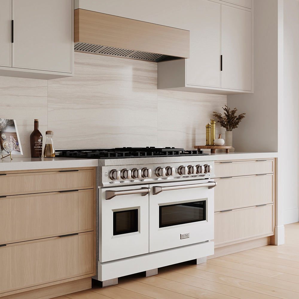 ZLINE 48 in. 6.7 cu. ft. Classic Dual Fuel Range with 8 Burner DuoPro™ Cooktop and Dual Ovens in Satin Stainless Steel with White Matte Doors (PCDRS-WM-48) in a custom kitchen with light wood cabinets, angled.