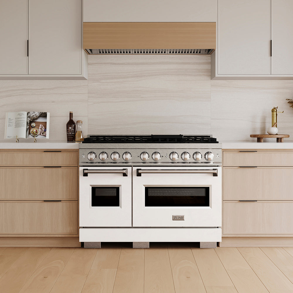 ZLINE 48 in. 6.7 cu. ft. Classic Dual Fuel Range with 8 Burner DuoPro™ Cooktop and Dual Ovens in Satin Stainless Steel with White Matte Doors (PCDRS-WM-48) in a custom kitchen with light wood cabinets, front.