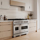 ZLINE 48 in. 6.7 cu. ft. Classic Dual Fuel Range with 8 Burner DuoPro™ Cooktop and Dual Ovens in Satin Stainless Steel (PCDRS-48) in a custom kitchen with light wood cabinets, angled.