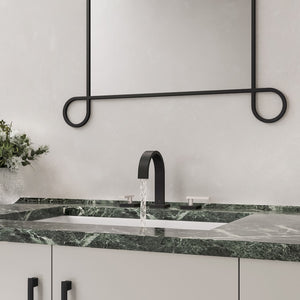 ZLINE Autograph Edition Bliss Widespread Bath Faucet in Matte Black and Brushed Nickel (BLS-BF-ZMBBN) with water running from the spout, installed in a dark green marble bathroom countertop with a white sink basin.