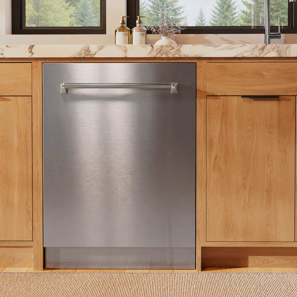 ZLINE Autograph Edition 24 in. Monument Series 3rd Rack Dishwasher with Auto Door Open Drying, 44dBa, Stainless Steel Panel with Polished Nickel Helix Handle (DWMTZ-30424-KPN) in a kitchen with wooden cabinets and a window view.