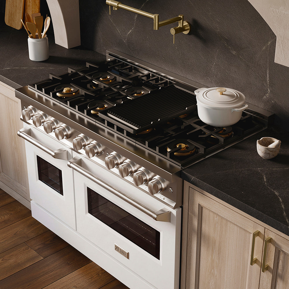 ZLINE 48 in. 6.7 cu. ft. Classic Dual Fuel Range with 8 Burner DuoPro™ Cooktop and Dual Ovens with White Matte Doors (PCDR-WM-48) in a designer kitchen with wood details and dark marble backsplash, angled.