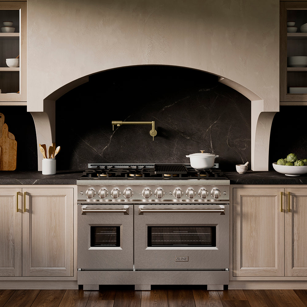 ZLINE 48 in. 6.7 cu. ft. Classic Dual Fuel Range with 8 Burner DuoPro™ Cooktop and Dual Ovens in Satin Stainless Steel (PCDRS-48) in a designer kitchen with wood details and dark marble backsplash, front.