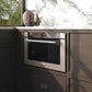 ZLINE 24 in. 1.2 cu. ft. Built-in Microwave Drawer with a Traditional Handle in Stainless Steel (MWD-1-H) embedded in wooden kitchen cabinets with a window view.