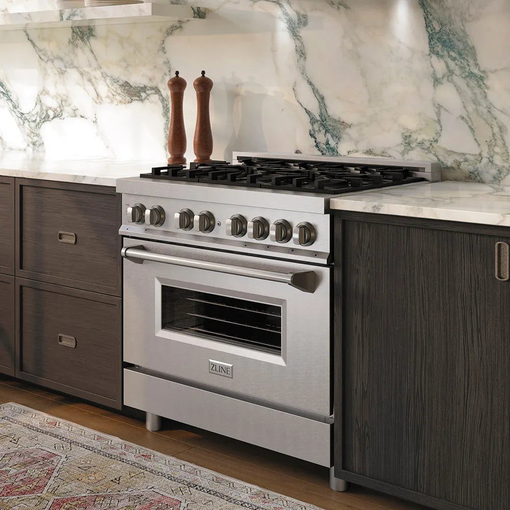 ZLINE 36 in. 4.6 cu. ft. Legacy Dual Fuel Range with 6 Burner Gas Cooktop and Electric Convection Oven in Stainless Steel (RA36) in a kitchen with marble backsplash and dark wood cabinets.