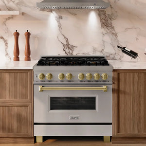 ZLINE Autograph Edition 36 in. 4.6 cu. ft. Legacy Dual Fuel Range with 6 Burner Gas Cooktop and Electric Convection Oven in Stainless Steel and Champagne Bronze Accents (RAZ-36-CB) set in a modern kitchen with marble backsplash and wood cabinets.