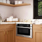 Modern kitchen with wooden cabinets, marble countertop, and ZLINE 24 in. 1.2 cu. ft. Built-in Microwave Drawer with a Traditional Handle in Stainless Steel (MWD-1-H).
