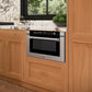 ZLINE 24 in. 1.2 cu. ft. Built-in Microwave Drawer with a Traditional Handle in Stainless Steel (MWD-1-H) embedded in wooden kitchen cabinetry with marble countertop.