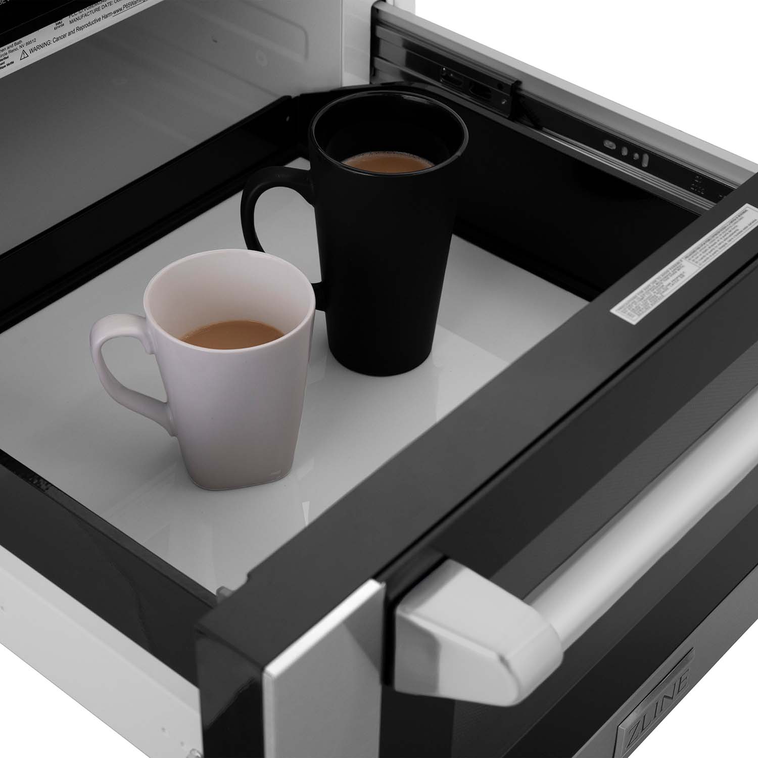 ZLINE microwave drawer with two cups of coffee inside.