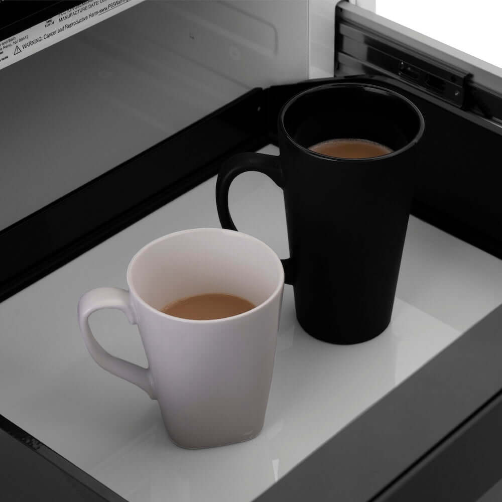 ZLINE Autograph Edition 24 in. 1.2 cu. ft. Built-in Microwave Drawer in Stainless Steel and Polished Nickel Helix Handle (MWDZ-1-H-KPN) two mugs of coffee inside open microwave drawer.