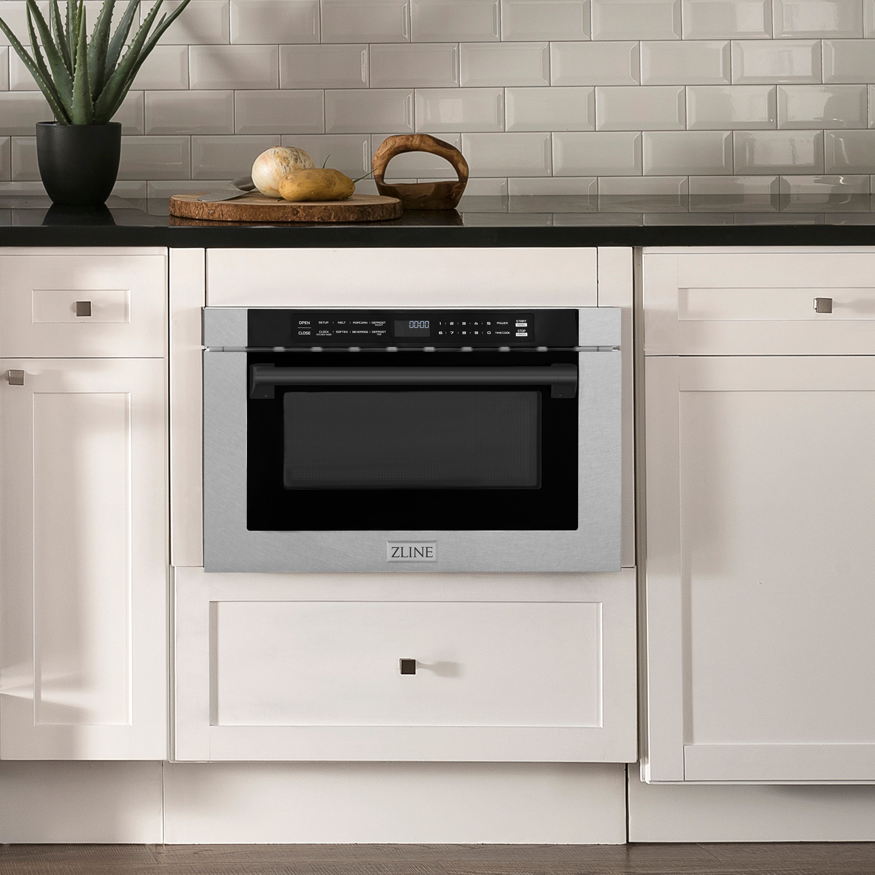 ZLINE Autograph Edition 24 in. Microwave in Fingerprint Resistant Stainless Steel with Traditional Handles and Matte Black Accents (MWDZ-1-SS-H-MB) in Rustic Farmhouse Style Kitchen with white cabinets and black countertops.