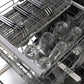 ZLINE 24 in. Monument Series 3rd Rack Dishwasher with Auto Door Open Drying, 44dBa, Black Stainless Steel Panel (DWMT-BS-24) close-up, utensils on adjusted third rack and glassware on top rack.