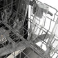 ZLINE Autograph Edition 24 in. Monument Series 3rd Rack Dishwasher with Auto Door Open Drying, 44dBa, Panel Ready with Matte Black Handle (DWMTZ-24-MB), close-up, open rack with glass bottles on bottle jets.