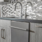 ZLINE 24 in. Stainless Steel Top Control Built-In Dishwasher with Stainless Steel Tub and Modern Style Handle, 52dBa (DW-304-24) built-in to cabinets in a luxury kitchen.