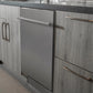 ZLINE 24 in. Stainless Steel Top Control Built-In Dishwasher with Stainless Steel Tub and Modern Style Handle, 52dBa (DW-304-24) built-in to cabinets in a luxury kitchen.